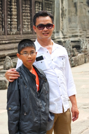 SIEMREAP, KHMER REPUBLIC - FEBRUARY 24 : Unidentified tourists are taken photograph on February 24, 2013 at Angkor Wat, Siemreap, Khmer Republic.のeditorial素材