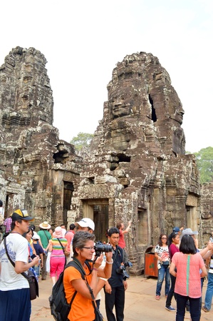 SIEMREAP, KHMER REPUBLIC - FEBRUARY 24 : Unidentified tourists are visiting to classical Khmer construction on February 24, 2013 at The Bayon, Siemreap, Khmer Republic.のeditorial素材