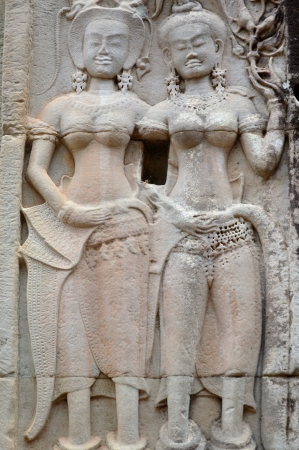 Stone carving of classical Khmer construction at Angkor Wat, it was built both as the state temple and capital dedicated to Vishnu.の写真素材