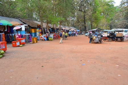 SIEMREAP, KHMER REPUBLIC - FEBRUARY 24 : Unidentified tourists are visiting to classical Khmer construction and shopping on February 24, 2013 at Prasat Ta Prohm, Siemreap, Khmer Republic.のeditorial素材