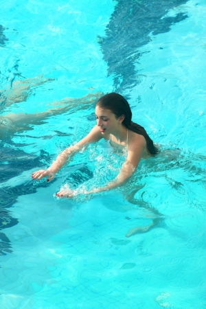 BANGKOK, THAILAND - MARCH 18 : Unidentified tourist is swimming in swimming pool on March 18, 2013 at Prince Palace Hotel, Boe Bae Tower, Bangkok, Thailand.のeditorial素材