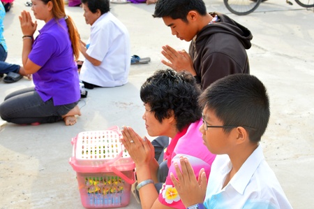 PAYAKKAPHUMPHISAI, MAHASARAKHAM - APRIL 13 : Unidentified people are asking for blessing from monks and novices in Thai New Year or Songkran Festival on April 13, 2013 at City Hall Plaza, Payakkaphumphisai, Mahasarakham, Thailand.のeditorial素材