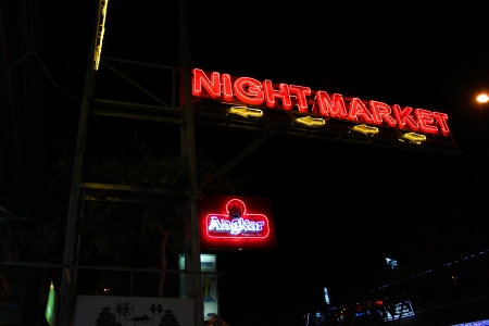 SIEMREAP, KHMER REPUBLIC - FEBRUARY 24 : Telling way sign is located at night market on February 24, 2013 in Siemreap, Khmer Republic.のeditorial素材