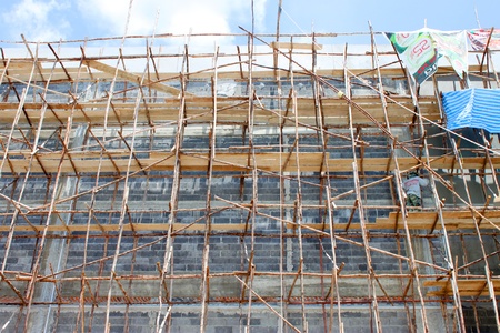 BURIRAM, THAILAND - JUNE 29 : Unidentified worker is working on Taweekit Plaza construction building site on June 29, 2013 in Buriram, Thailand.のeditorial素材
