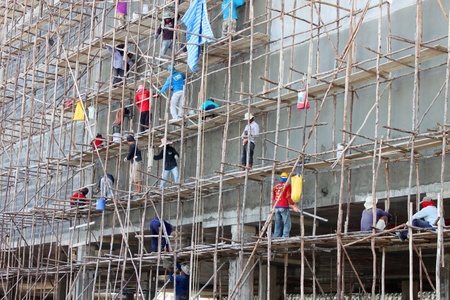 BURIRAM, THAILAND - JUNE 29 : Unidentified workers are working on Taweekit Plaza construction building site on June 29, 2013 in Buriram, Thailand.のeditorial素材