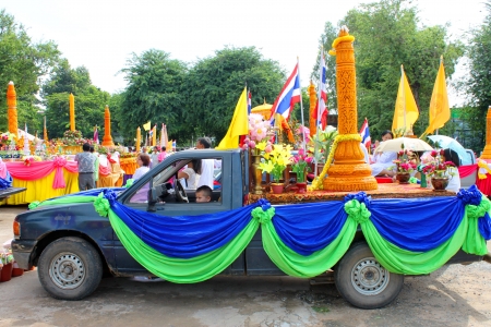 MAHASARAKHAM, THAILAND - JULY 19 : Unidentified people are participating in Buddhist Lent festival parade at city hall plaza on July 19, 2013 in Mahasarakham, Thailand.のeditorial素材