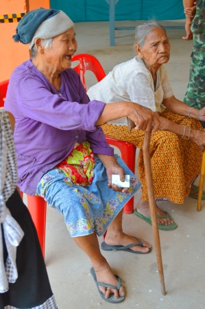 MAHASARAKHAM, THAILAND - APRIL 22 : Unidentified old women sit and wait to vote for village headman election on April 22, 2013 in Ban Nong Weang, Muang, Mahasarakham, Thailand.のeditorial素材