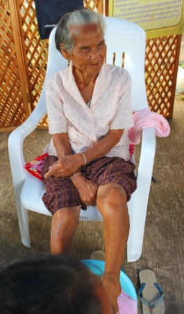 MAHASARAKHAM, THAILAND - AUGUST 22   Unidentified women are having spa massage in public healthy mobile project on August 22, 2013 in Kerng village, Mahasarakham, Thailand のeditorial素材