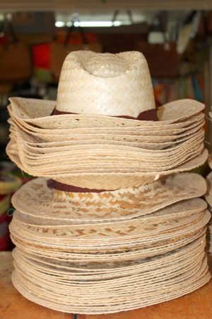 handmade straw hats on sale in marketの写真素材