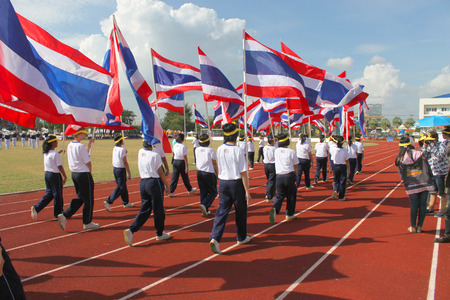MAHASARAKHAM - NOVEMBER 8   Unidentified university students are marching along athletic ground in 12 th Ti Cup closing ceremony on November 8, 2013 in Mahasarakham, Thailand のeditorial素材
