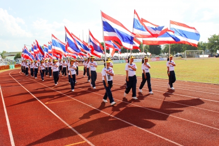 MAHASARAKHAM - NOVEMBER 8   Unidentified university students are marching along athletic ground in 12 th Ti Cup closing ceremony on November 8, 2013 in Mahasarakham, Thailand のeditorial素材