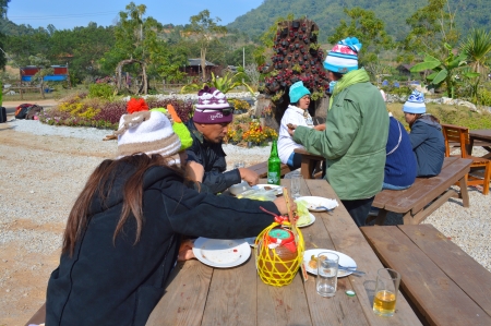 NONG HIN, LOEI - DECEMBER 22   Unidentified tourists have breakfast in winter campfire party at Phu Pha Ngam home stay on December 22, 2013 in Nong Hin, Loei, Thailand  のeditorial素材