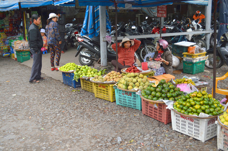 HUE, VIETNAM - MARCH 15   Merchants are selling foods and fruits at Dong Ba market on March 15, 2014 in Hue, Vietnam  Dong Ba is the biggest market in Hue, Vietnam のeditorial素材