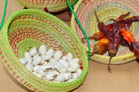 Jack bean and dried chili pepper in Kratip or sticky rice utensil 