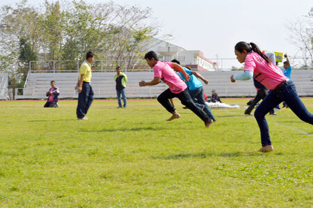 MAHASARAKHAM - JANUARY 18   Unidentified people are playing sack race which the ancient amusing game of traditional Thai people at Ratchaphat University playground on January 18,2014 in Mahasarakham,Thailand  のeditorial素材