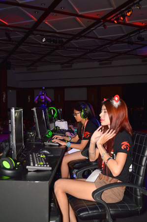 BANGKOK - AUGUST 2   Competitors prepare to play video game in Point Blank Thailand Championship 2014 at Queen Sirikit national convention center on August 2, 2014 in Bangkok, Thailand のeditorial素材