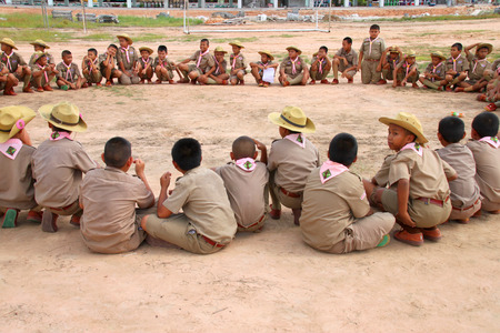 PAYAKKAPHUMPHISAI, MAHASARAKHAM - SEPTEMBER 3 : Children scouts are playing game and sport at public Anuban school on September 3, 2015 in Payakkaphumphisai, Mahasarakham, Thailand.のeditorial素材