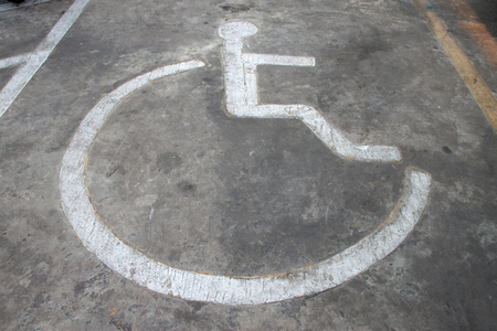 disorder patient wheelchair sign painting on car parking floorの写真素材