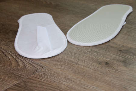 white sandals on wooden floor in the morning light roomの写真素材