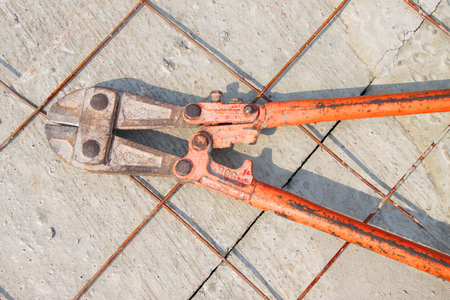big pliers cutting deserted on concrete floorの写真素材