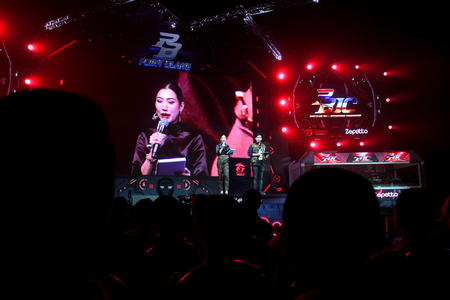 BANGKOK - SEPTEMBER 24 : Master of ceremonies are on duty in grand opening and competition of Point Blank International Championship 2016 at Central World on September 24, 2016 in Bangkok, Thailand.のeditorial素材
