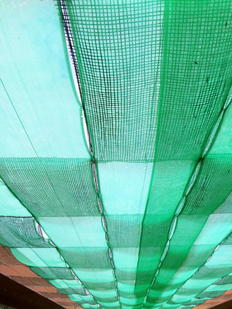old shading net under sun light,の写真素材