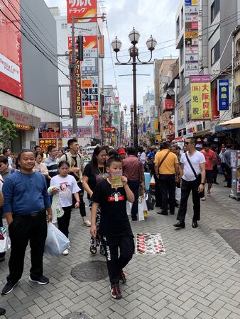 OSAKA, JAPAN - AUGUST 24, 2019 : Tourists travel to and shopping at Doutonbori street, Numba and Shinsaibashi the famous large market and metropolitan area on August 24, 2019 in Osaka, Japan.のeditorial素材