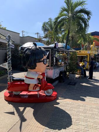NAKHON RATCHASIMA, THAILAND - DECEMBER 15, 2019 : Cartoon statues are displayed in front of food shop on December 15, 2019 in Nakhon Ratchasima, Thailand.のeditorial素材