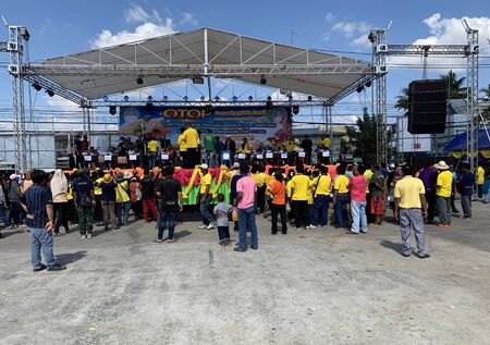MAHA SARAKHAM, THAILAND - DECEMBER 19, 2019 : People watch the competition on stage of One Tambon One Product (OTOP) exhibition on December 19, 2019 in Payakkaphum Phisai, Maha Sarakham, Thailand.のeditorial素材