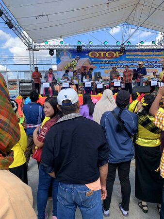 MAHA SARAKHAM, THAILAND - DECEMBER 19, 2019 : People watch the competition on stage of One Tambon One Product (OTOP) exhibition on December 19, 2019 in Payakkaphum Phisai, Maha Sarakham, Thailand.のeditorial素材