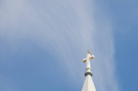 Church steeple, rooster on top with blue sky in background  Dalat, Vietnam Landmark の写真素材