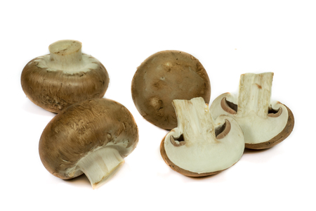 Fresh whole and halved brown Baby Bella mushroomsの写真素材