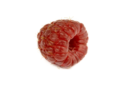 Close up of ripe raspberry isolated on white background