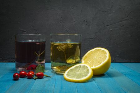 Selection of food against flu. Natural product for excellent immunity - herbal tea, lemon, rose hipsの写真素材
