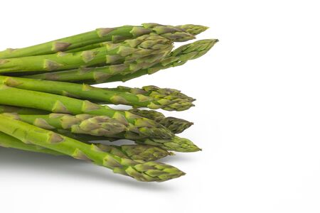 Bunch of fresh green asparagus isolated on white backgroundの写真素材