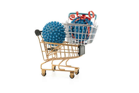 Virus molecule on a shopping cart and basket conceptual of the possibility of infection with corona virus or Covid-19 over a white backgroundの写真素材