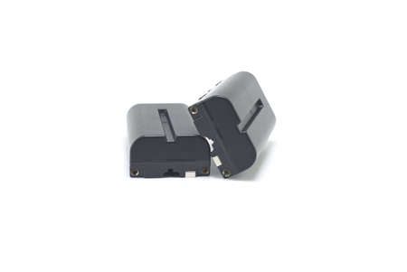 Two NP-F type rechargeable batteries isolated on a white background, electronics and camera equipmentの写真素材