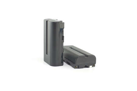 Two NP-F type rechargeable batteries isolated on a white background, electronics and camera equipmentの写真素材