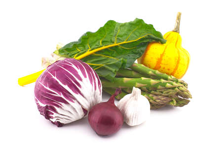Assortment of fresh colorful including leaf beet, asparagus, radicchio salad, onion and garlic isolated on white backgroundの写真素材