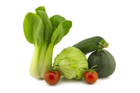 Chinese cabbage and white cabbage green round courgette, zucchini and cherry tomato isolated on white backgroundの写真素材