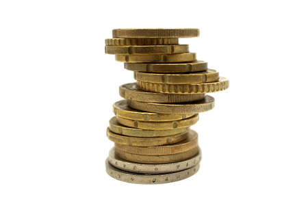 Stack of coins isolated on white background, viewed side on low angleの写真素材