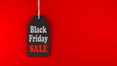Black Friday Sale tag on red background in a panoramic format to use as header or web banner with copy space for text. Black Friday sale, shopping conceptの写真素材