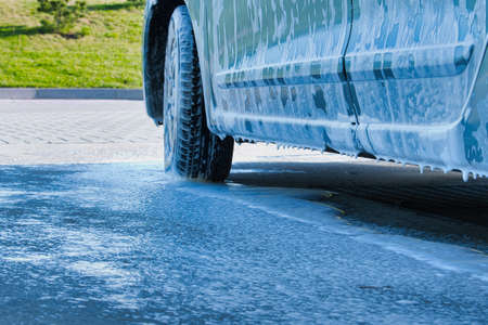 Outdoor car wash with snow foam car wash shampoo. Easily remove the dust, dirt, oil, traces of insectsの写真素材