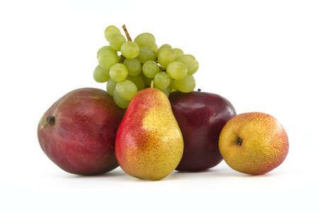 Assortment of fresh healthy fruits including mango, pears, grapes and apple isolated on a white backgroundの写真素材