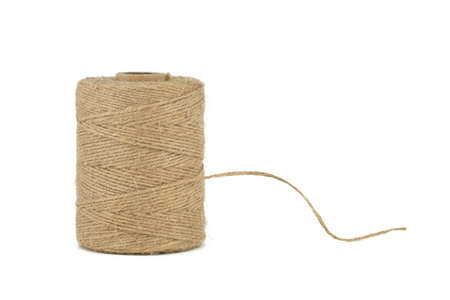 Natural burlap thread or jute twine roll in close-up isolated on white background