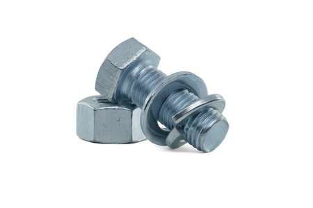 Hexagon external screw and female screw, flat and spring nut washers coated with a protective layer of zinc isolated on white backgroundの写真素材