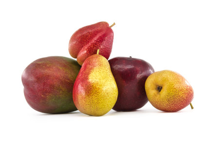 Assortment of fresh healthy fruits including mango, pears and apple isolated on a white backgroundの写真素材