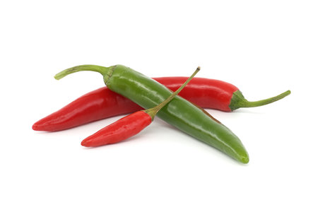 Red and green hot chili peppers isolated on white backgroundの写真素材