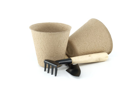 Round plant & seed starter peat pots for planting isolated on white background. Biodegradable compostable nursery pots for vegetables herbs flowersの写真素材