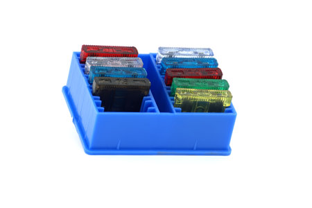 Various colored automobile fuses with open circuit used to protect the wiring and electrical...